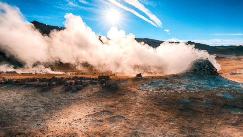 Steaming cone in Hverir geothermal area with boiling mudpools and steaming fumaroles in Iceland  Location: geothermal area Hverir, Myvatn region, North part of Iceland, Europe