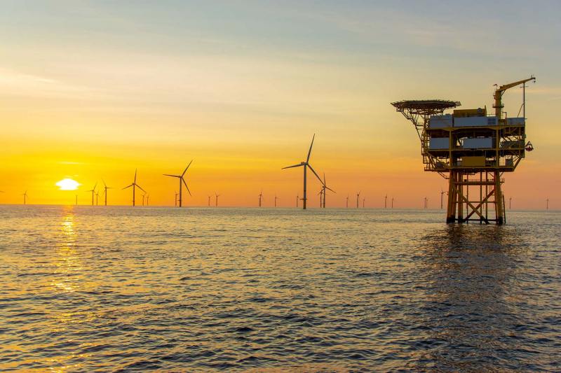 Beautiful sunset at the North Sea offshore wind farm Beautiful sunset at the North Sea offshore wind farm